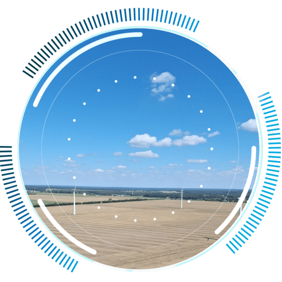skywings.com.pl - A blue sky with scattered clouds over a wide landscape of wind turbines, viewed through a digital interface overlay—ideal for showcasing wind turbine inspection service and electrical maintenance solutions. Wind Turbine Service & Maintenance, Windenergieanlagen-Service & Instandhaltung