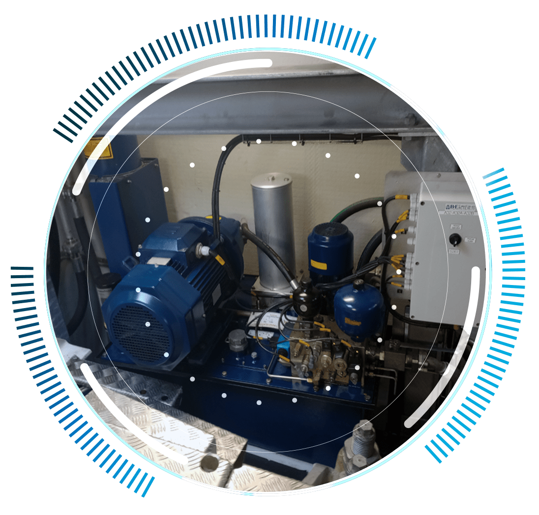 skywings.com.pl - A blue industrial motor and pump system with connected pipes and control panel, enclosed in a circular graphic frame with blue accents—ideal for Windturbinen-Getriebe-Reparatur or other wind turbine drivetrain maintenance needs. Wind Turbine Service & Maintenance, Windenergieanlagen-Service & Instandhaltung