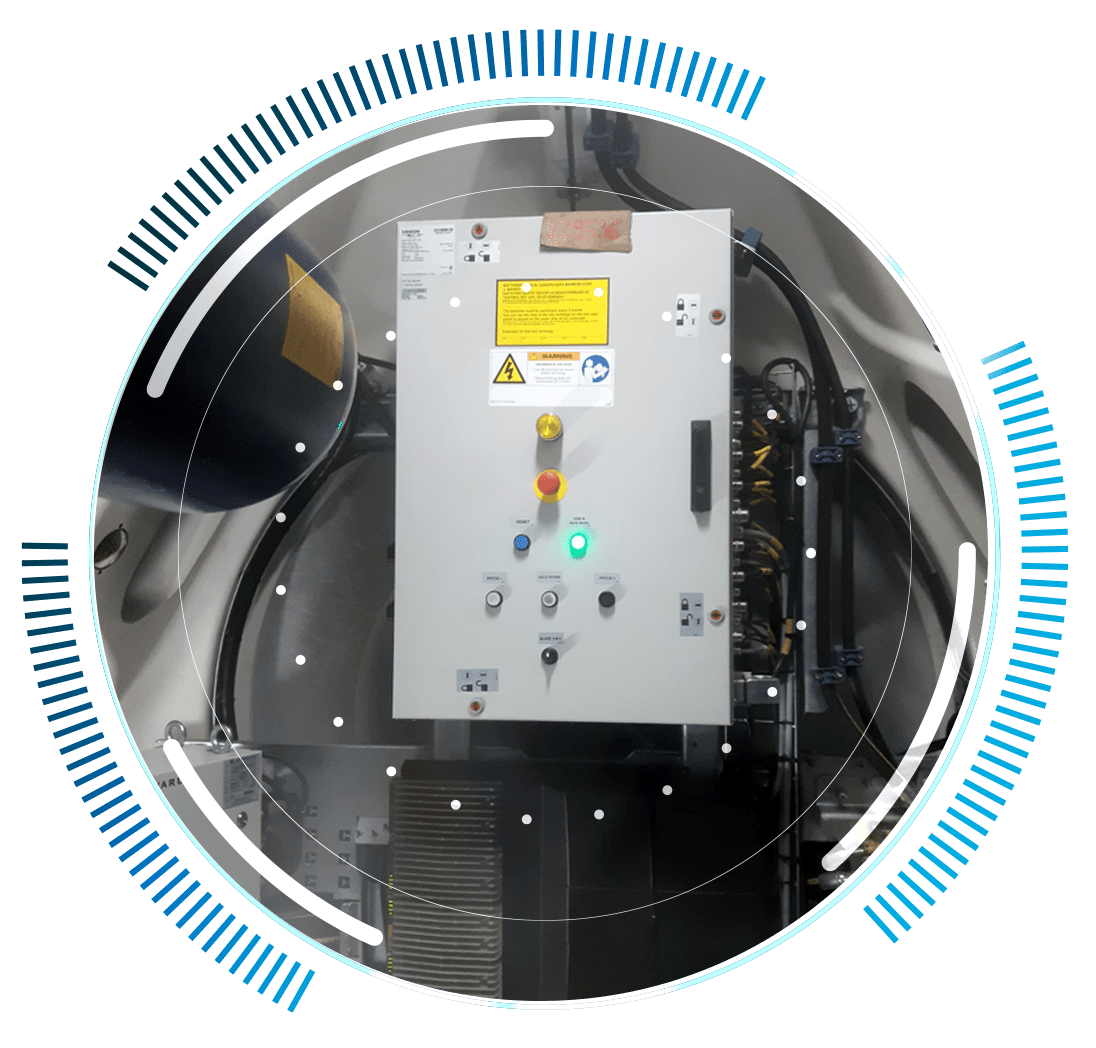 skywings.com.pl - A control panel with buttons, switches, and indicator lights is mounted inside an industrial setting, surrounded by digital circular graphic elements and blue accents—ideal for Windenergieanlagen-Service or wind turbine gearbox repair. Wind Turbine Service & Maintenance, Windenergieanlagen-Service & Instandhaltung